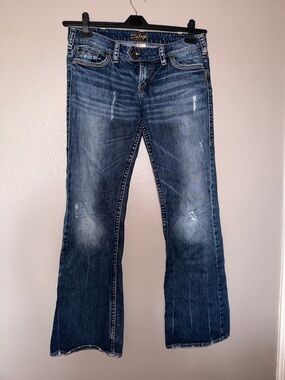 Silver Jeans Distressed Mid-Blue Flare Jeans
